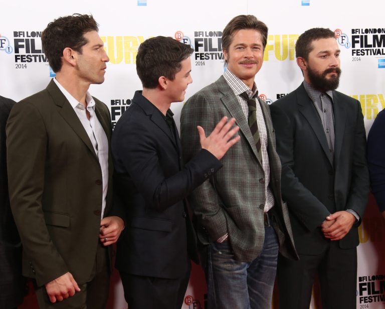 Actors, from left, Jon Bernthal, Logan Lerman, Brad Pitt and Shia LaBeouf pose for photographers at the photo call for the film Fury, which closes the BFI London Film Festival, at the Corinthia hotel in central London, Sunday, Oct. 19, 2014. (Photo by Joel Ryan/Invision/AP)