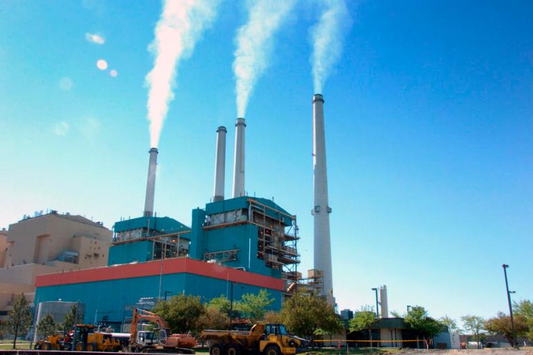 In this July 1, 2013, photo smoke rises from the Colstrip Steam Electric Station, a coal burning power plant in in Colstrip, Mont. The Obama administration wants to cut emissions from power plants by 30 percent by 2030. (AP Photo/Matthew Brown, File)