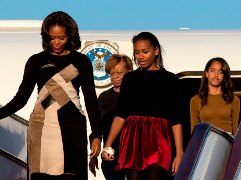 First Lady Michelle Obama, front left, her daughters Sasha, front right, Malia, right in the back, and Michelle Obama's mother Marian Robinson, arrive in China. AP Photo