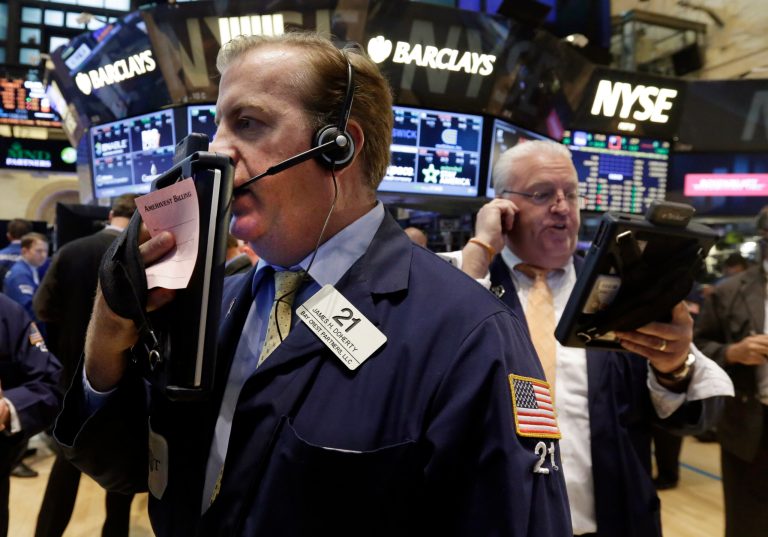 Traders James Doherty, left, and Thomas Ferrigno work on the floor of the New York Stock Exchange Tuesday, Aug. 19, 2014. Better news on home building and corporate earnings are sending stocks higher. (AP Photo/Richard Drew)