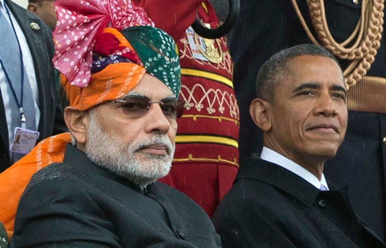 Indian Prime Minister Narendra Modi, left, and U.S. President Barack Obama watch the Republic Day parade in New Delhi, India, Monday, Jan. 26, 2015. Republic Day marks the anniversary of India's democratic constitution taking force in 1950. (AP Photo/Stephen Crowley, Pool)