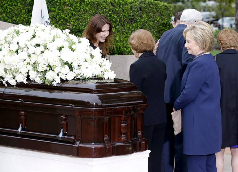 Hillary Clinton (right) looks at the casket during the graveside service for Nancy Reagan in Simi Valley, Calif. (AP Photo/Chris Carlson)