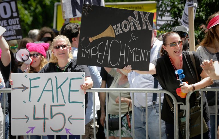 Protesters rally outside a Trump hotel to call for the impeachment of President Trump, Sunday July 2, 2017, in New York. A statement from the organizer's website said President Trump 