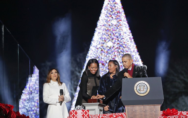 President Obama, first lady Michelle Obama and their daughter Sasha lighting the 2016 National Christmas Tree during the tree lighting ceremony. (AP Photo/Pablo Martinez Monsivais)