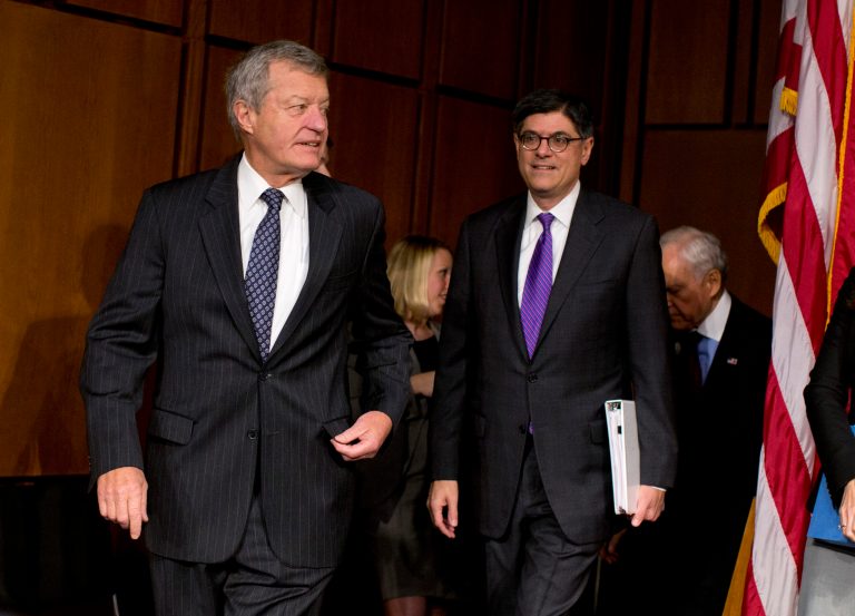 Treasury Secretary Jacob Lew, right, follows Senate Finance Committee Chairman Sen. Max Baucus, D-Mont., on Capitol Hill in Washington, Thursday, Oct. 10, 2013, prior to Lew testifying before the committee. Lew headed to Capitol Hill to both give and get a public scolding. Lew's appearance before the Senate Finance Committee promised to be yet another public restatement of the administration's stance that Congress needs to reopen the government and lift the U.S. borrowing cap before Obama will negotiate over the nation's budget ills.  (AP Photo/ Evan Vucci)