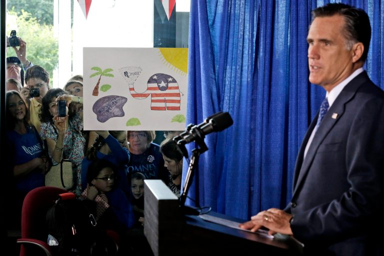 Supporters waiting outside try to catch a glimpse of Republican presidential candidate, former Massachusetts Gov. Mitt Romney as he makes comments on the killing of U.S. embassy officials in Benghazi, Libya, while speaking in Jacksonville, Fla.,  Wednesday, Sept. 12, 2012. (AP Photo/Charles Dharapak)