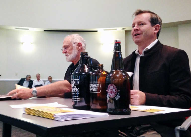 In this July 8, 2014 image, Chris Goblet, right, executive director of the New Mexico Brewers Guild, testifies before a legislative committee as Berkeley Merchant, general manager of the Abbey Beverage Co., prepares for his presentation during a meeting in Albuquerque, N.M. Dozens of breweries and taprooms have popped up in New Mexico in recent years, and state lawmakers say the burgeoning industry has the potential to boost economic development. (AP Photo/Susan Montoya Bryan)