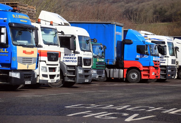 Lorries are parked up at a service station on the M4 motorway on March 7, 2012 near Chepstow, Wales. Campaigners for fairer fuel prices were expected to be in Parliament today urging the Government to cut fuel tax duty and to scrap any further rises. (Photo by Matt Cardy/Getty Images)