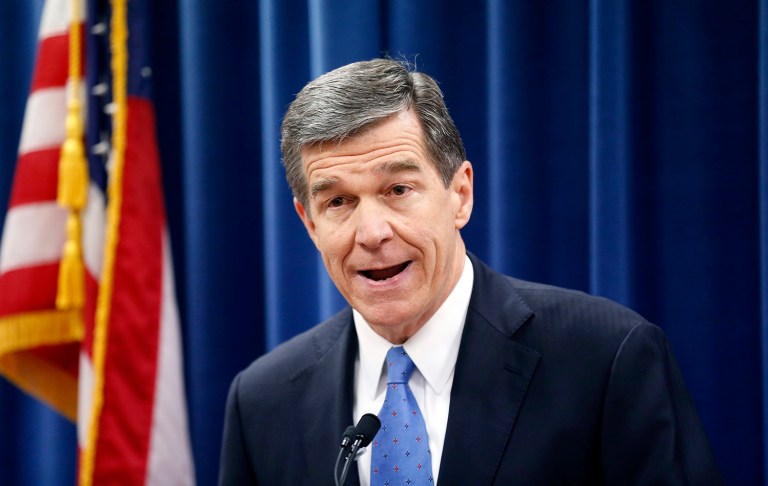North Carolina's Gov.-elect Roy Cooper holds a press conference to criticize efforts by Republicans to cut the power of the governor's office during the special session of the General Assembly that is going on a few blocks away in Raleigh, N.C. (Chris Seward /The News & Observer via AP, File)