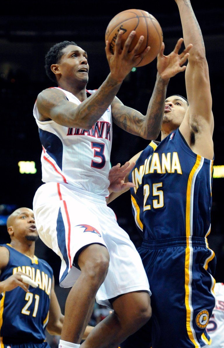   Atlanta Hawks guard Louis Williams (3) shoots as Indiana Pacers small forward Gerald Green (25) defends during the second half of an NBA basketball game on Saturday, Dec. 29, 2012, at Philips Arena in Atlanta. Atlanta won 109-100. (AP Photo/John Amis)  