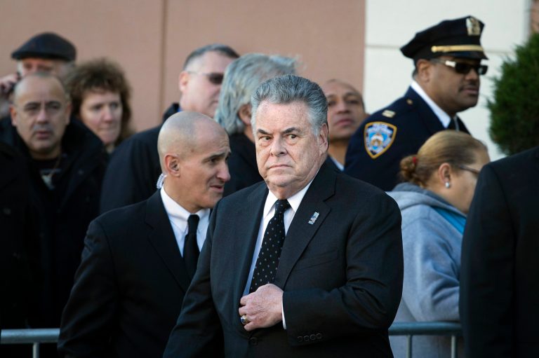 Rep. Peter King exits the wake of officer Rafael Ramos at Christ Tabernacle Church, in the Glendale section of Queens, Friday, Dec. 26, 2014, in New York. (AP Photo/John Minchillo)