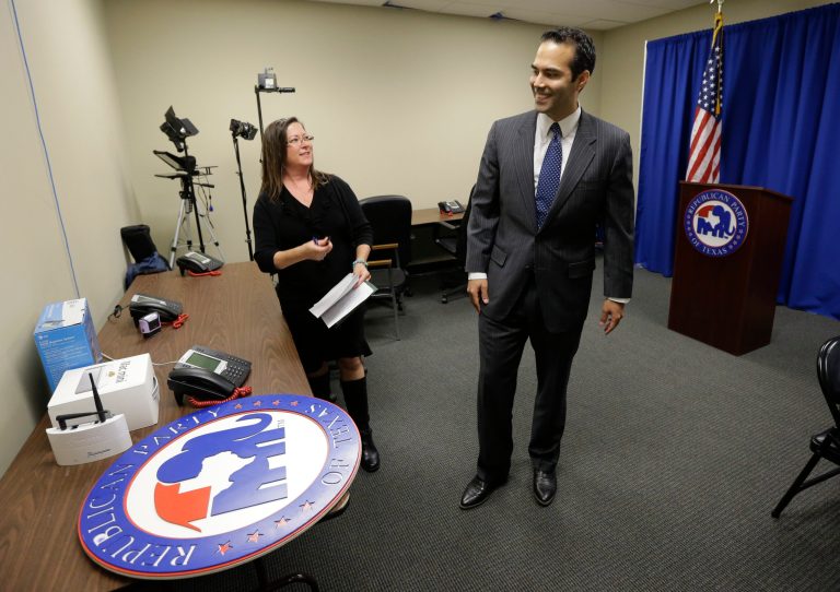 George P. Bush, right, the grandson of one former president and nephew of another, visits the Republican Party of Texas headquarters where he formally filed to run for Texas land commissioner in Austin. (AP/Eric Gay)

