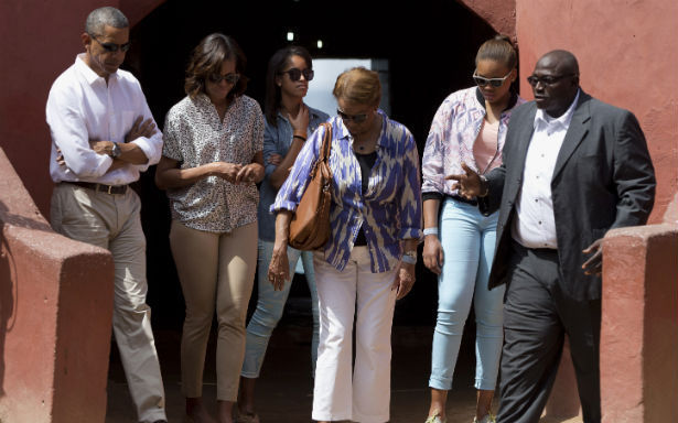 President Barack Obama, first lady Michelle Obama, daughter Malia Obama, mother in-law Marian Robinson, and niece Leslie Robinson take a tour of Goree Island with Eloi Coly, right, on Thursday, June 27, 2013, in Goree Island, Senegal. (AP Photo/Evan Vucci)