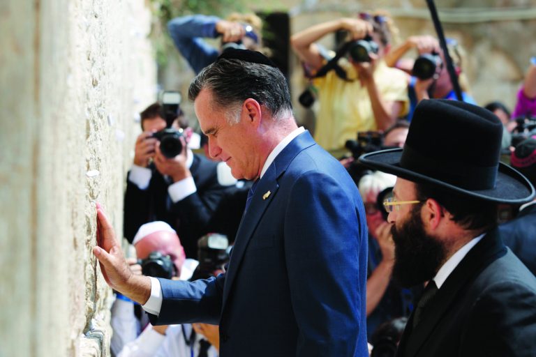 Republican presidential candidate and former Massachusetts Gov. Mitt Romney pauses next to the Western Wall, in Jerusalem, Sunday, July 29, 2012. (AP Photo/Dan Balilty)