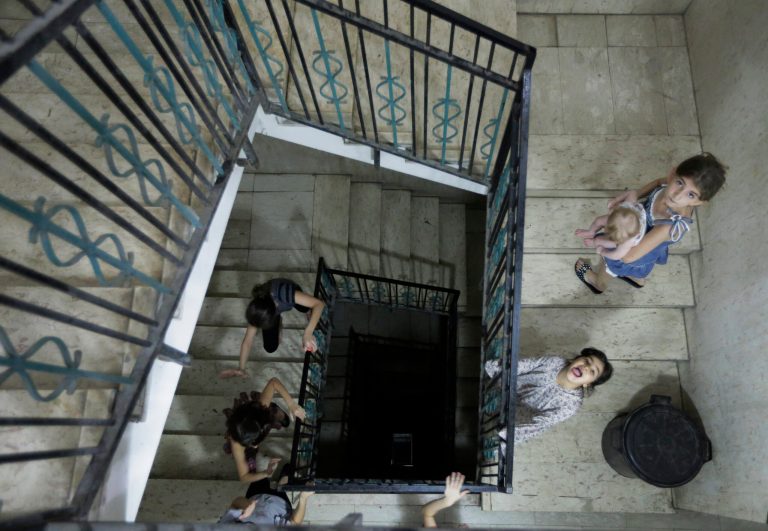 Restricted from playing outside, displaced Palestinian children play indoors in a high-rise building where their families had rented flats for them to live, after leaving their homes due to the unrest, in Gaza City, Sunday, Aug. 10, 2014. (AP Photo/Lefteris Pitarakis)