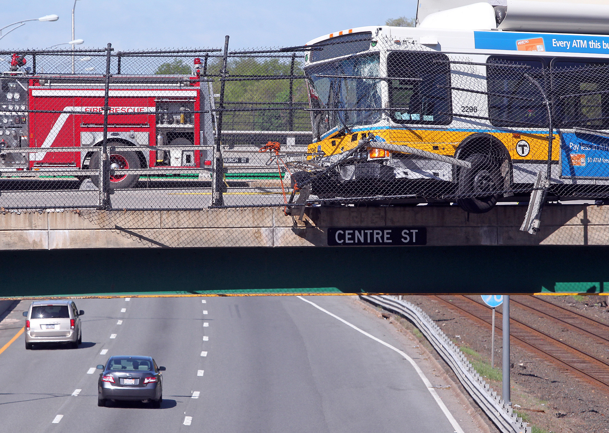 Bus hangs over Massachusetts Pike after crash