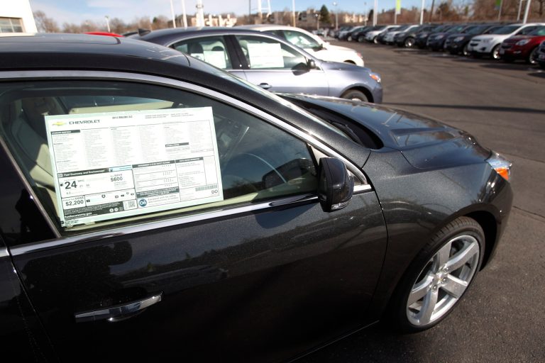 FILE - In this Jan. 20, 2013 photo, 2013 Chevrolet Mailbus sit at a Chevrolet dealership in Englewood, Colo. General Motors reports monthly sales on Tuesday, June 17, 2014. Cars such as the Malibu have retained or increased their value, sometimes more than rival vehicles in the same market segment. (AP Photo/David Zalubowski, File)