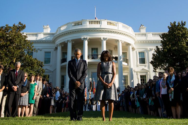 President Obama, first lady Michelle Obama and others observe a moment of silence to mark the 14th anniversary of the 9/11 attacks onÂ Friday, Sept. 11, 2015.Â (AP Photo)Â 