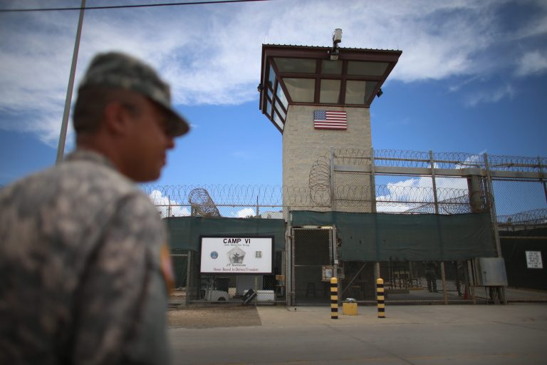 A military officer stands near the entrance to Camp VI at the U.S. military prison for 'enemy combatants' on June 25, 2013 in Guantanamo Bay, Cuba. (Photo by Joe Raedle/Getty images)