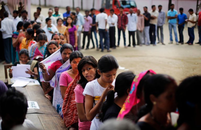 Indian voters wait in queues to cast their votes during the first phase of elections in Dibrugarh, in the northeastern state of Assam, India, Monday, April 7, 2014. Indians began voting Monday in the world's biggest election, with the opposition heading into the polls with strong momentum on promises of economic renewal. The country's 814 million eligible voters will vote in stages over the next five weeks. (AP Photo/Altaf Qadri)