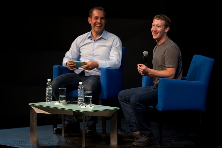 Facebook co-founder Mark Zuckerberg, right, speaks to the scholarship recipients of the Telmex Foundation during the annual Mexico XXI Century event in Mexico City, Friday, Sept. 5, 2014. At left is Javier Olivan, Facebook's VP of Growth and Analytics. (AP Photo/Dario Lopez-Mills)