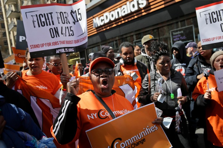 Protesters rally for higher pay in front of a McDonald's, Wednesday, April 15, 2015, in New York. (AP Photo/Seth Wenig)
