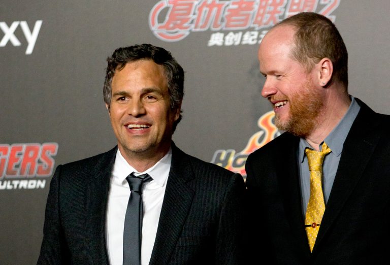 Actor Mark Ruffalo, left, and director Joss Whedon, right, pose for photos at a red carpet event for their latest film, Marvel's 