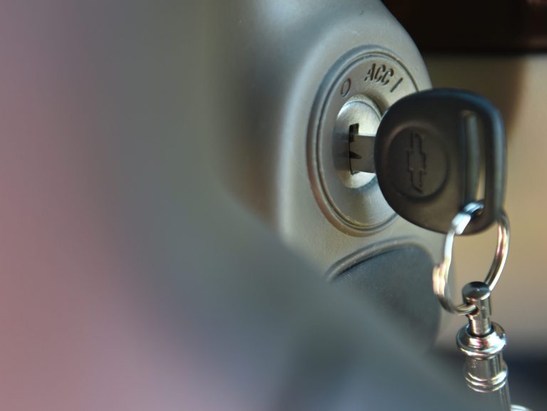 FILE - This April 1, 2014 file photo shows the ignition switch of a 2005 Chevrolet Cobalt in Alexandria, Va. The ignition switch on the Cobalt and other small cars was so poorly designed that it easily slipped out of the run position, causing engines to stall. Engineers knew it; as early as 2004, a Cobalt stalled on a GM test track when the driver's knee grazed the key fob. By GM's admission, the defective switches caused over 50 crashes and at least 13 deaths. (AP Photo/Molly Riley, File)