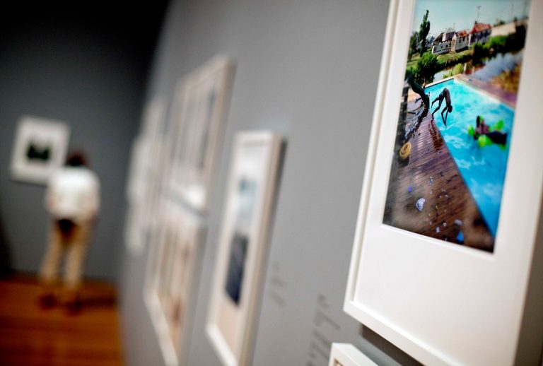   This June 7, 2012 photo shows a framed photo by Dallas-based photographer Kael Alford is displayed as part of the âPicturing the Southâ exhibit at the High Museum of Art in Atlanta. Alford depicts small communities in eroding marshlands of Louisiana. (AP Photo/David Goldman)  