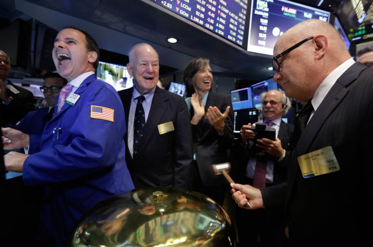 Fairmount Santrol Chairman William Conway, CEO and President Jennifer Deckard, and company director Charles Fowlerl, second left to right, celebrate as their IPO begins trading, on the floor of the New York Stock Exchange Friday, Oct. 3, 2014. Specialist John Alatzas is at left. (AP Photo/Richard Drew)