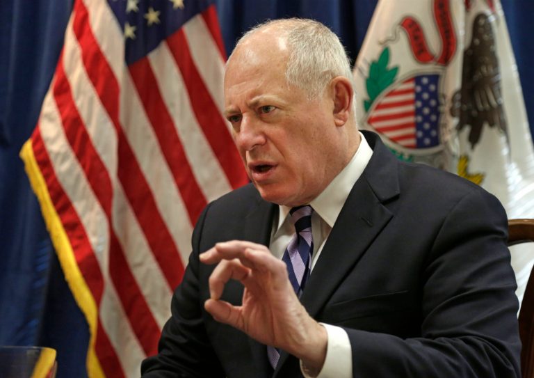Illinois Gov. Pat Quinn is using the holiday weekend honoring Martin Luther King Jr. to continue pressing for raising Illinois' minimum wage to at least $10. (AP Photo/M. Spencer Green)
