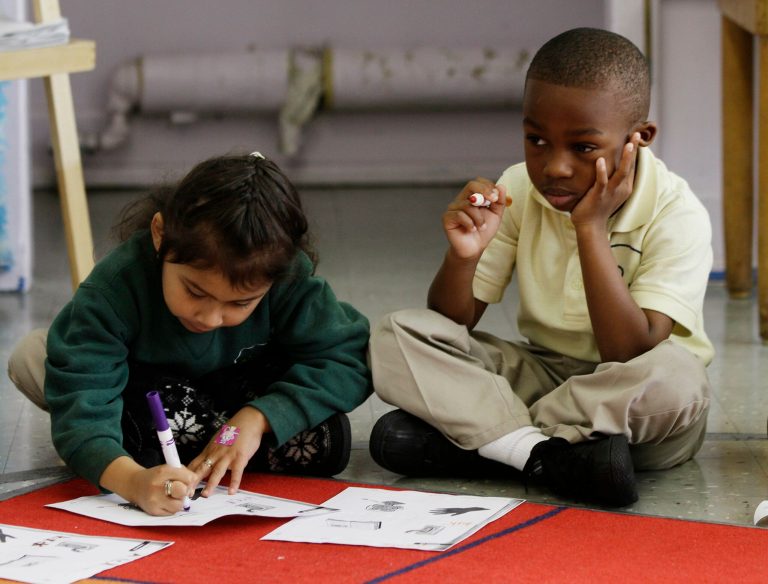 In this photo taken Thursday, Dec. 9, 2010, young students work on their writing skills in a kindergarten class at Berkeley Maynard Academy in Oakland, Calif. (AP Photo/Marcio Jose Sanchez)