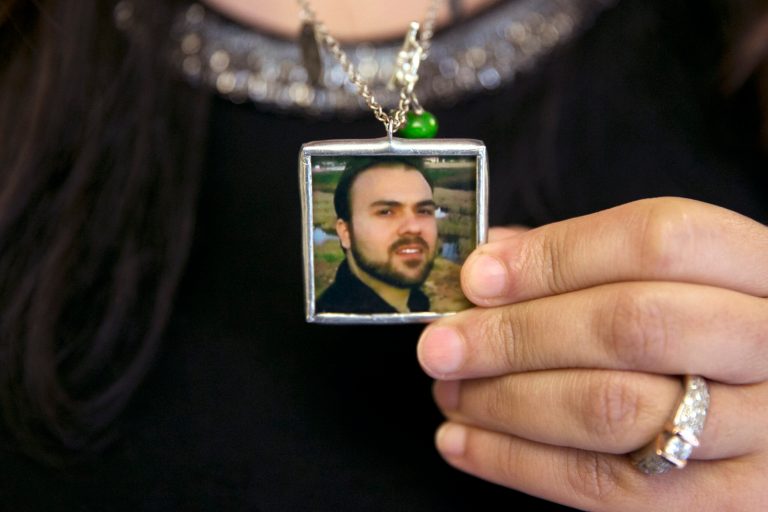 Naghmeh Abedini holds a necklace with a photograph of her husband, Saeed Abedini. (AP Photo/Jacquelyn Martin)