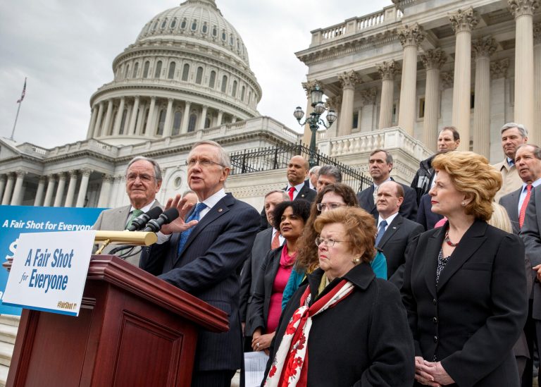 Senate Majority Leader Harry Reid of Nev., and other Democrats, urge approval for raising the minimum wage, during a news conference on Capitol Hill in Washington, Wednesday, April 2, 2014. Front row, from left are, Senate Health, Education, Labor and Pensions Committee Chairman Sen. Tom Harkin, D-Iowa, Reid, Senate Appropriations Committee Committee Chair Sen. Barbara Mikulski, D-Md., and Senate Senate Agriculture Committee Chair  Sen. Debbie Stabenow, D-Mich. In the coming days, the Senate could debate a plan by Iowa Democrat Tom Harkin that would gradually lift today's minimum wage of $7.25 an hour to $10.10 by 2016. President Barack Obama wants to increase the hourly minimum wage as part of an election-year economic agenda focused on working families. (AP Photo/J. Scott Applewhite)