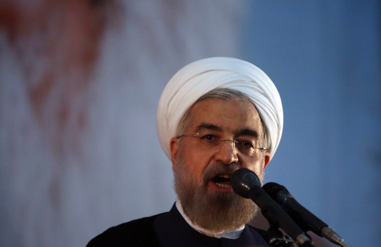 Iranian President Hassan Rouhani makes an address during a ceremony marking the 25th death anniversary of Ayatollah Khomeini, the founder of the Islamic Republic, at his shrine just outside Tehran, Iran, Tuesday, June 3, 2014. Iran's moderate president said Tuesday that his administration will defend the Islamic Republic's nuclear rights and work to end international sanctions that have devastated its economy. (AP Photo/Vahid Salemi)