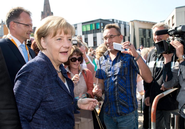 German Chancellor Angela Merkel arrives for an election campaign in Eberswalde, Germany, Saturday, Sept. 6, 2014. Merkel said in her weekly podcast Saturday that 75 years after Germany attacked Poland which led to World War II and the killing of six million Jews, it remains a top priority for the country to make Jews here feel safe. She expressed worries that there is not a single Jewish institution in the country without police protection. (AP Photo/dpa/Bernd von Jutrczenka)