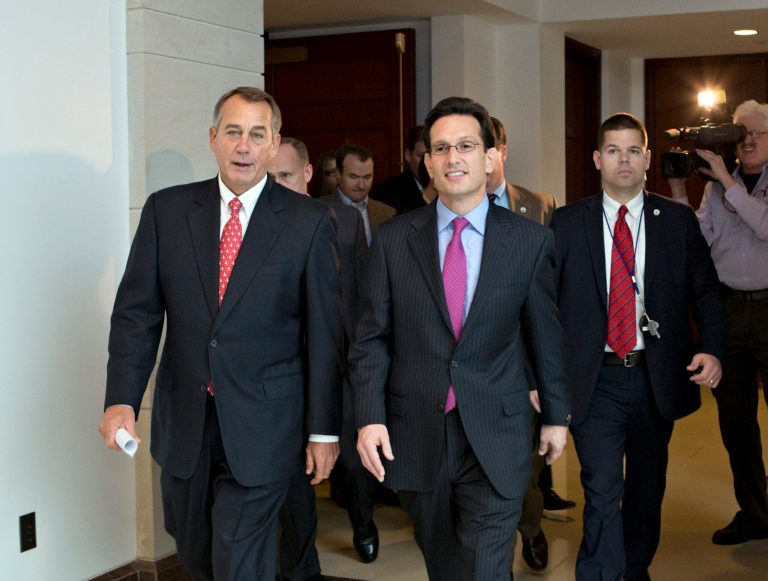   Speaker of the House John Boehner, R-Ohio, left, joined by House Majority Leader Eric Cantor, R-Va., returns to his office after speaking to reporters on the fiscal cliff negotiations, at the Capitol in Washington, Friday, Dec. 21, 2012. Hopes for avoiding the 