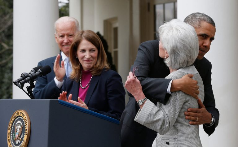 President Barack Obama hugs outgoing Health and Human Services Secretary Kathleen Sebelius as he stands with Vice President Joe Biden and his nominee to be her replacement, Budget Director Sylvia Mathews Burwell, Friday, April 11, 2014, in the Rose Garden f the White House in Washington. The moves come just over a week after sign-ups closed for the first year of insurance coverage under the so-called Obamacare law.(AP Photo/Charles Dharapak)