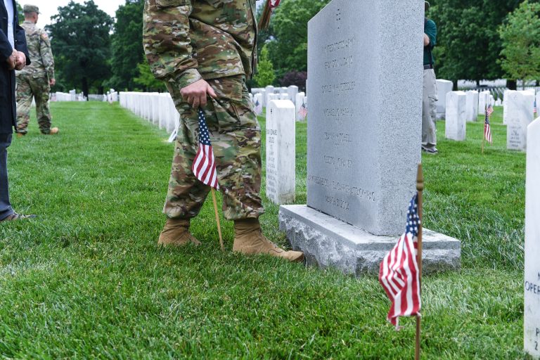 Army Chief of Staff Gen. Mark Milley places flags during the annual Flags-In event at Arlington National Cemetery on Thursday. (Army photo)