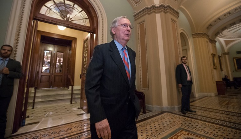 Climate change activists protested inside the Capitol Hill office of Senate Majority Leader Mitch McConnell Wednesday to demand that he recognize the role of global warming and fossil fuels in the recent spate of hurricanes. 
		 (AP Photo/J. Scott Applewhite)