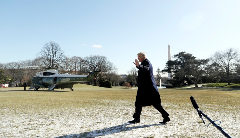 President Trump walks on the South Lawn as he leaves the White House on Friday enroute to Camp David, Md., to participate in a leadership retreat with senior administration officials and leaders in Congress. (AP Photo/Andrew Harnik)