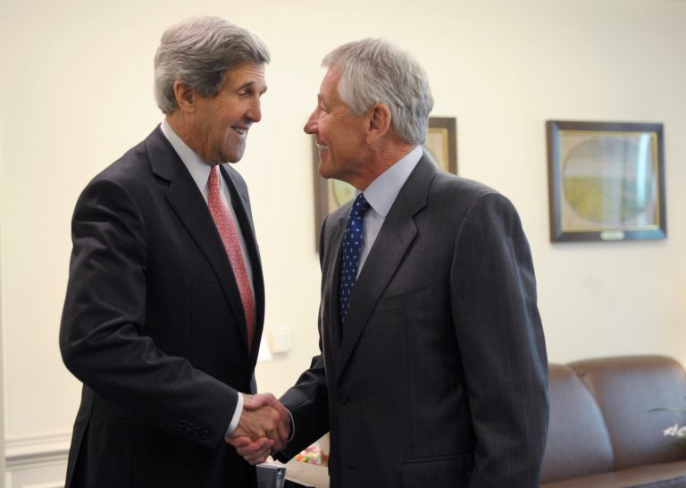 Defense Secretary Chuck Hagel, right, welcomes Secretary of State John Kerry, left, to his office at the Pentagon in Washington, Monday, May 6, 2013. Hagel invited Kerry to the Pentagon for a working lunch to discuss a range of national security issues. (AP Photo/Susan Walsh)