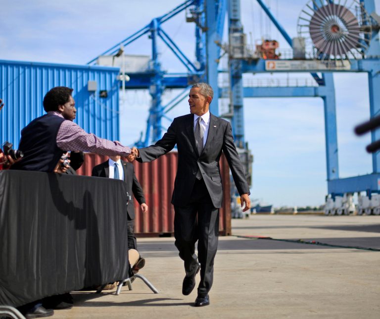 President Barack Obama shakes hands with a guest before taking the stage to speak at the Port of New Orleans, Friday, Nov. 8, 2013, in New Orleans. (AP Photo/Pablo Martinez Monsivais)