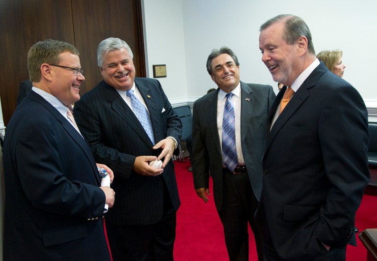Republican state legislators, from left, Rep. Tim Moore, Sen. Tom Apodaca, Sen. Bob Rucho and Sen. Phil Berger confer before a Senate session in Raleigh, N.C. on Thursday, July 31, 2014. (AP Photo/The News and Observer, Chris Seward)