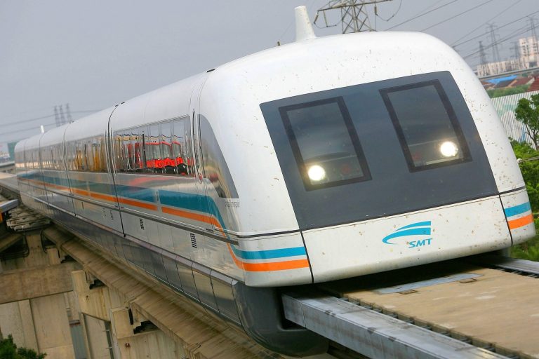 A maglev train approaches a station on July 24, 2006 in Shanghai, China. (Photo by China Photos/Getty images)