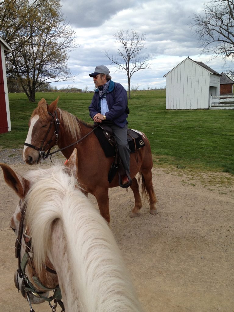   This April 12, 2012 photo shows battlefield guide Les Fowler giving a tour of Spangler farm which served as a field hospital during and after the July 1-3 1863 battle in Gettysburg, Pa., a turning point in the Civil War. Gettysburg can be toured in a number of ways, but on horseback you can transport yourself to the vantage and vulnerability of a Civil War officer on horseback directing his troops in the three-day battle. (AP Photo/Nancy Nussbaum)  