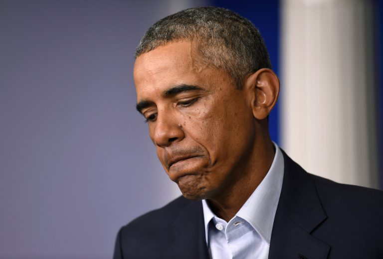 President Barack Obama pauses as he speaks in the James Brady Press Briefing Room in the White House in Washington, Monday, Aug. 18, 2014. Taking a two-day break from summer vacation, Obama met with top advisers at the White House to review developments in Iraq and in racially charged Ferguson, Mo., two trouble spots where Obama has ordered his administration to intervene. (AP Photo/Susan Walsh)