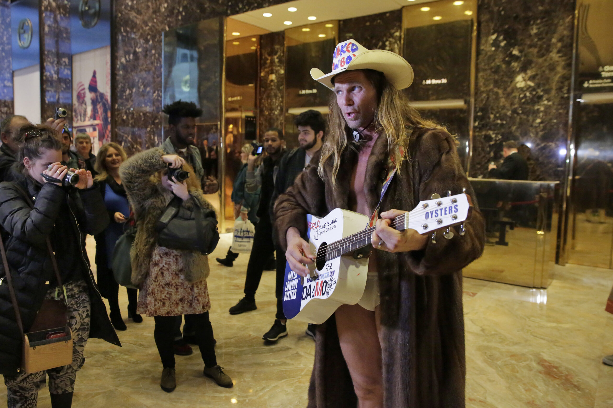 WATCH: North Dakota Sen. Heidi Heitkamp boards Trump Tower elevator with the Naked Cowboy