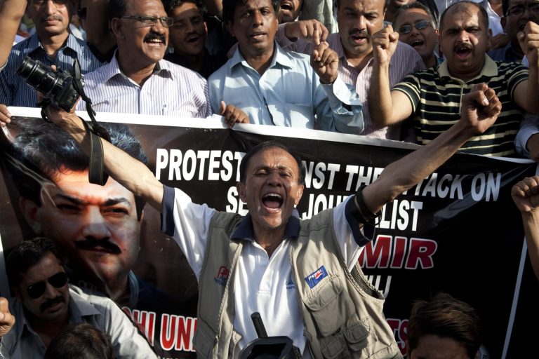 Pakistani journalists protest for their colleague Hamid Mir, who was shot and injured by gunmen in Karachi on Saturday, Monday, April 21, 2014 in Karachi, Pakistan. Police in Pakistan said gunmen shot the famous television talk show host amid a wave of attacks on journalists in the country. Police say Hamid Mir, a host on the private television broadcaster Geo, was wounded in the attack Saturday, April 19, 2014, near Karachi's airport. (AP Photo/Shakil Adil)