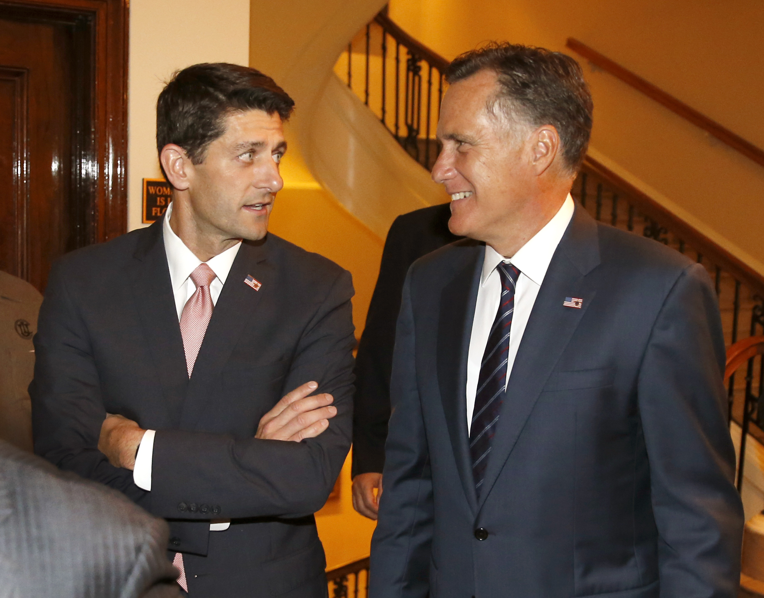 Possible speaker candidate Paul Ryan talks to Mitt Romney